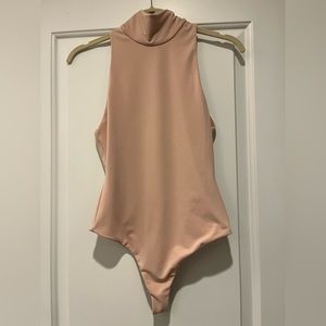 Alice and Olivia nude bodysuit. Brand new with tags. Size XS.